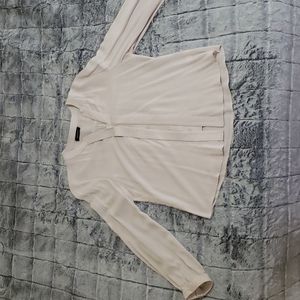 Long sleeved cream blouse